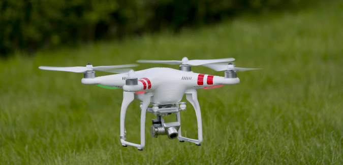 Drone /UAV hovering above grass - EASA are planning Europe Wide Regualtory Framework for the Operation of Drones