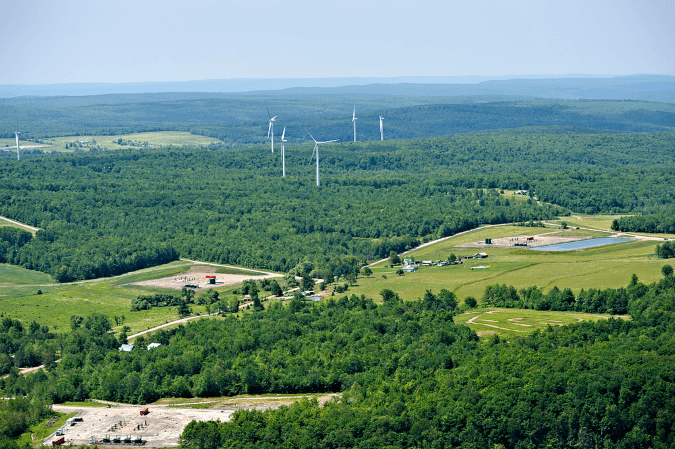 Wind turbines in the United States surrounded by fracking sites