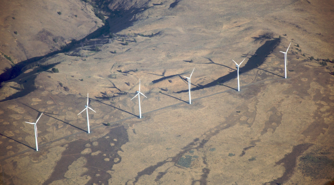 Aerial view of a wind farm in The current position of wind turbine radar mitigation 