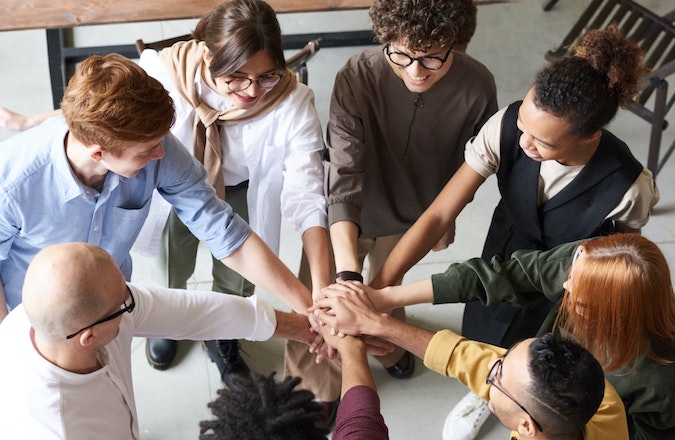 People putting hands together
