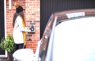 Person charging EV