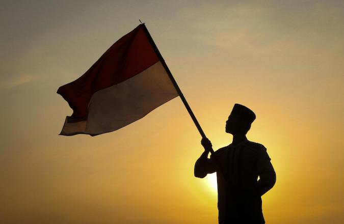 Man holding an Indonesian Flag