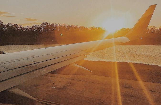 Bright sunlight over the wing of an aircraft