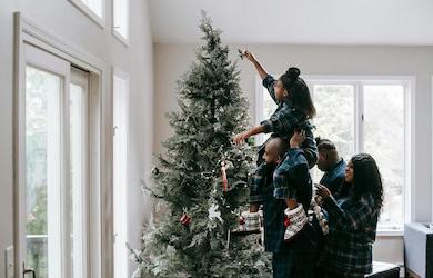 Family putting up Christmas tree