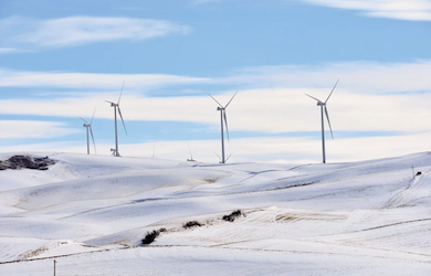 Wind Turbines on Snow Covered Field