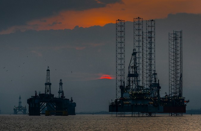 A group of oil rigs in the sea